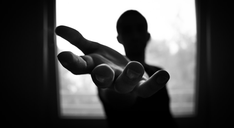 man-s-hand-in-shallow-focus-and-grayscale-photography-167964